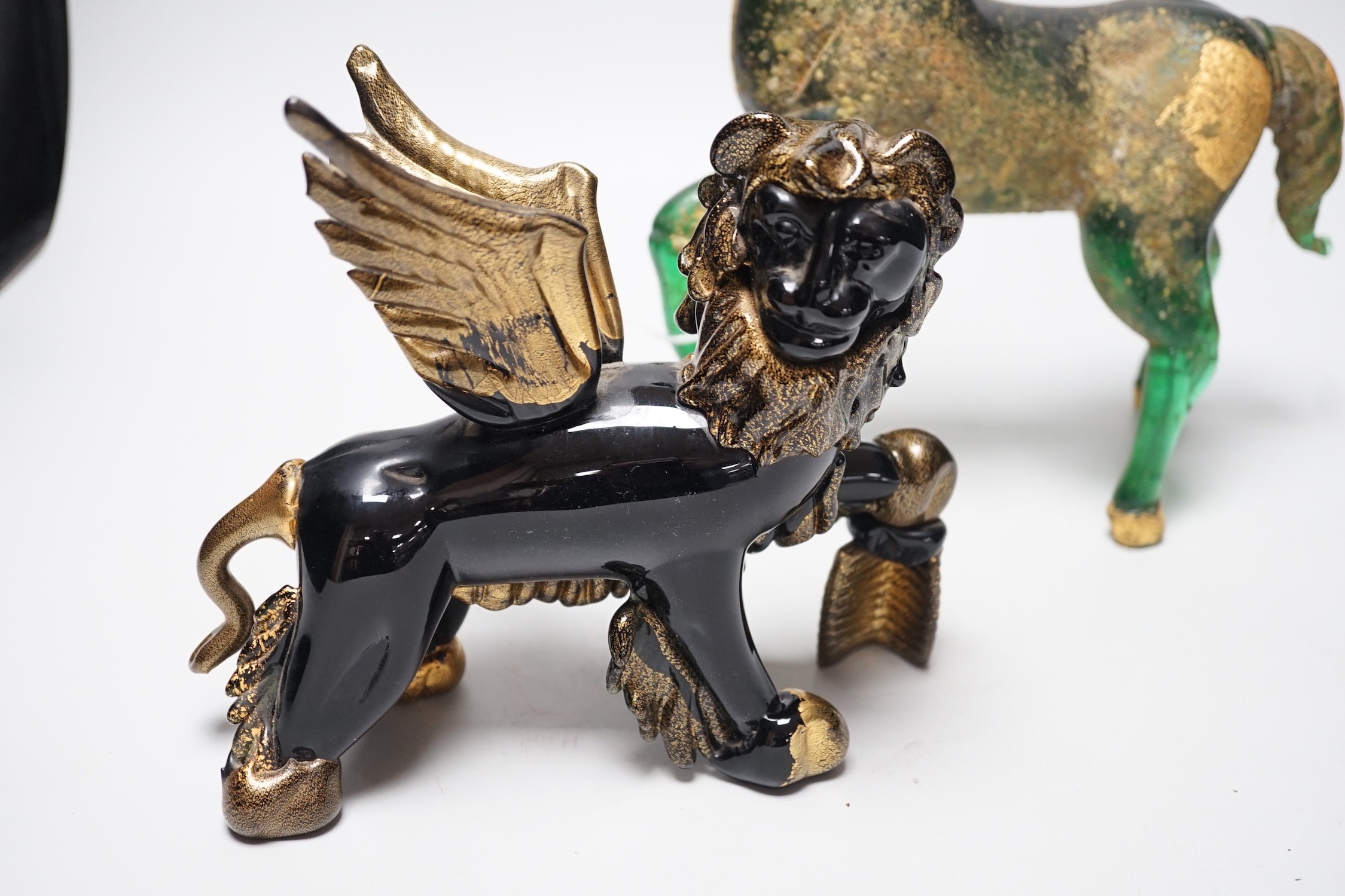 A Murano gilded glass model of the Lion of Venice, 21 cm long and a gilded green glass figure of a horse, 31cm